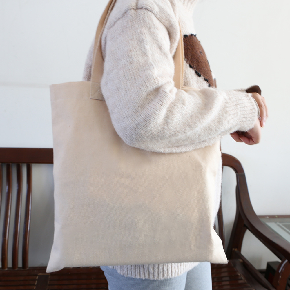 Bolsa de lona en blanco al por mayor bolsa de algodón estudiante de un hombro bolsa de lona de compras bolsa de lona portátil de publicidad se puede utilizar como logotipo