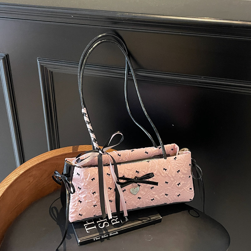 Bolso de axila de chica caliente fresco de moda 2025 verano nuevo bolso femenino lindo lazo bolso de hombro de color de contraste de estilo occidental