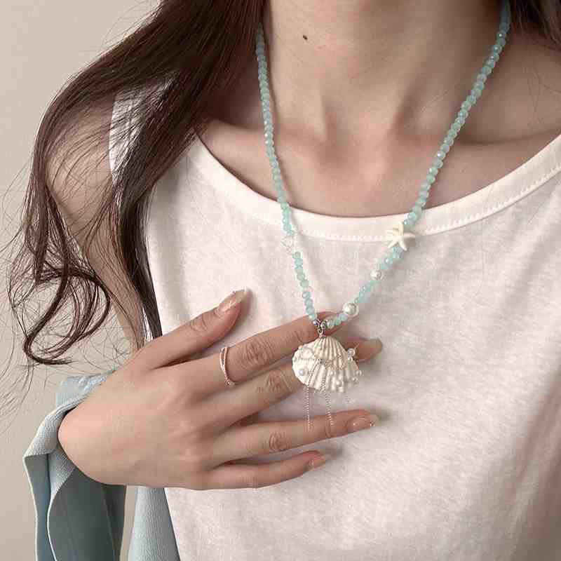 Cuerda de cera estrella de mar concha colgante de perlas collar vacaciones de verano estilo cadena de clavícula cadena de suéter de moda fresca y dulce mujer