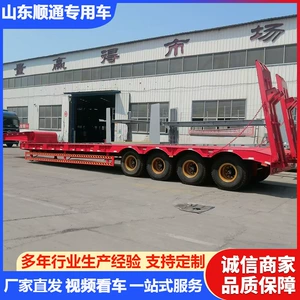 Foreign trade hydraulic heavy-duty lowbed semi-trailer with a four-axle design, featuring a fully raised cargo bed