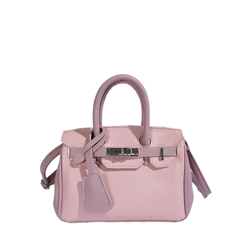 Bolso de platino portátil de litchi para mujeres 2026 comercio exterior nuevo estilo de alto nivel de sensación de tamaño de estilo de hombro mochila