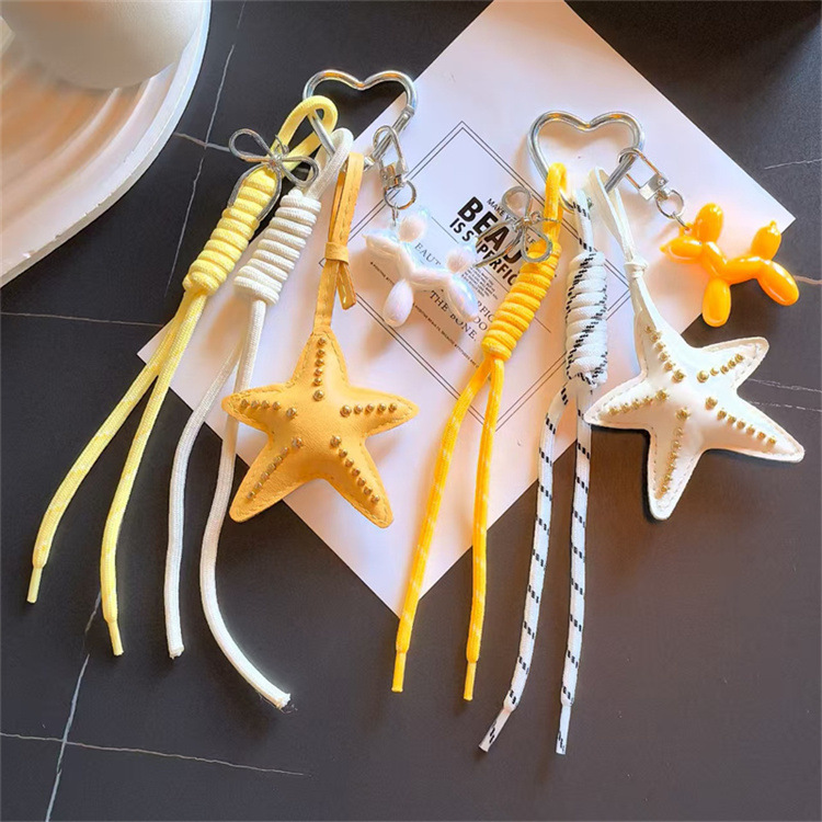 Transición fronteriza Miu Tie Wind Keychain original coreano hecho en casa colgante de arco de viento lindo fabricante de cuerda tejida a mano