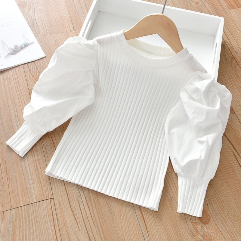 女の子の泡の袖の底のシャツの2025春秋は新型の子供の小さい子供の洋風の長袖のtシャツの韓国版の上着を詰めます。