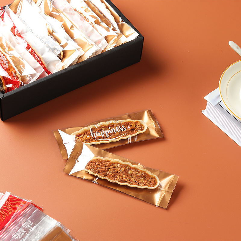 Clásico tipo barco de arroz glutinoso embalaje rectangular máquina de hornear bolsa de sellado en stock fábrica al por mayor bolsa de embalaje de piruletas