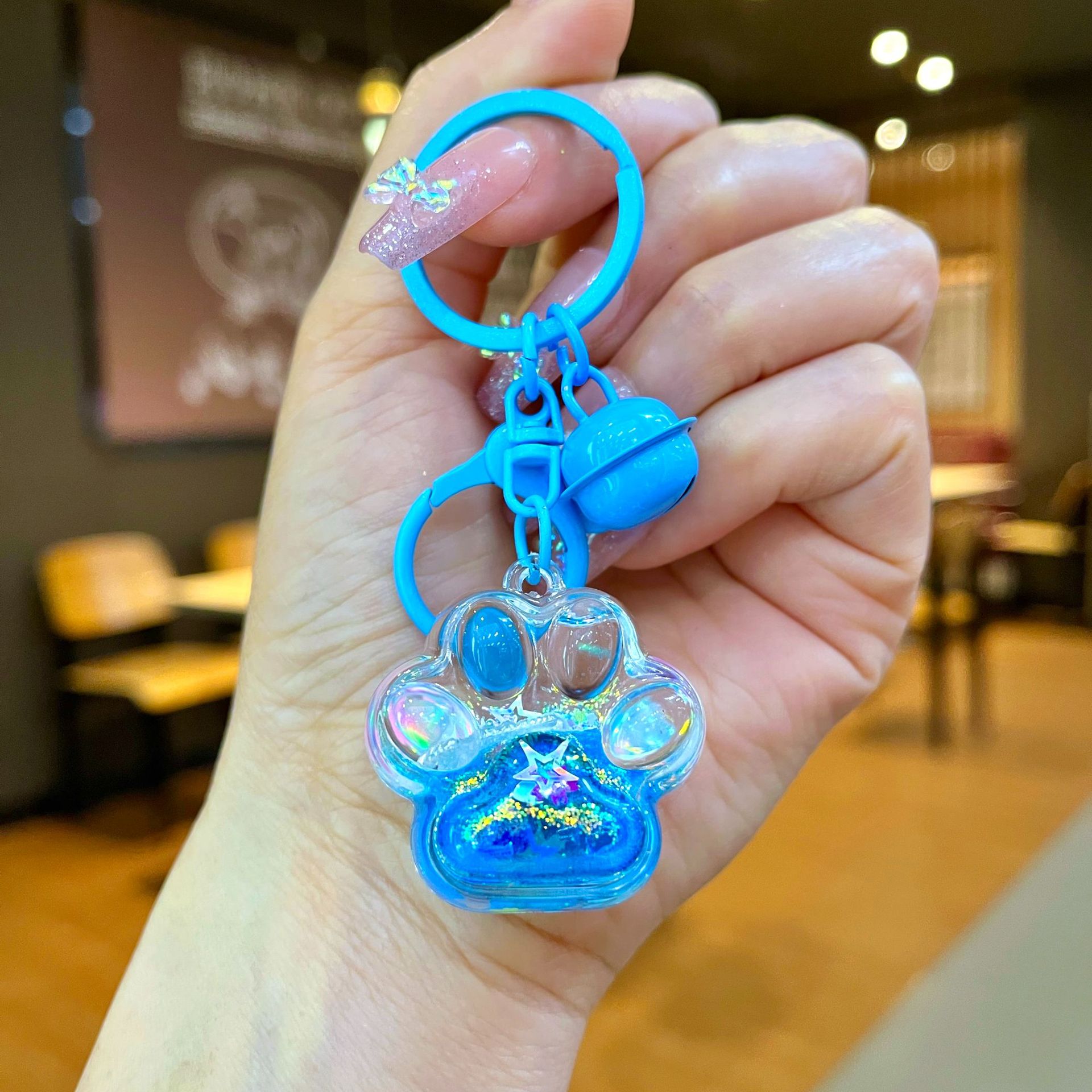 Aceite de gato garra arenas movedizas llavero lindo dibujos animados cadena colgante captura muñeca máquina agarrar pequeño regalo al por mayor