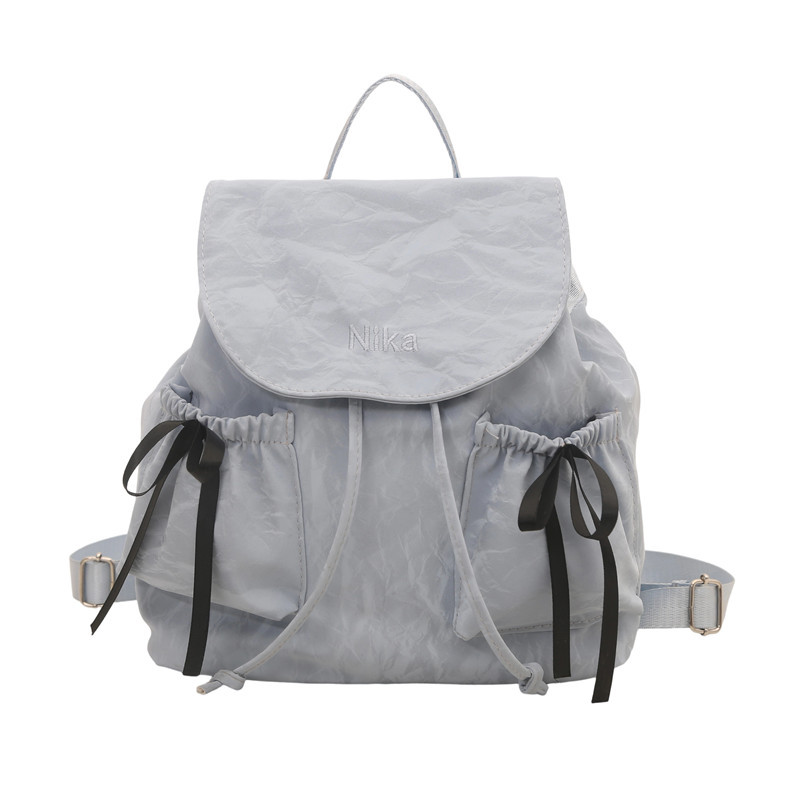 Mochila de lazo de sentido de alta gama para mujer 2025 nueva moda mochila de viaje mochila escolar casual para estudiantes coreanos