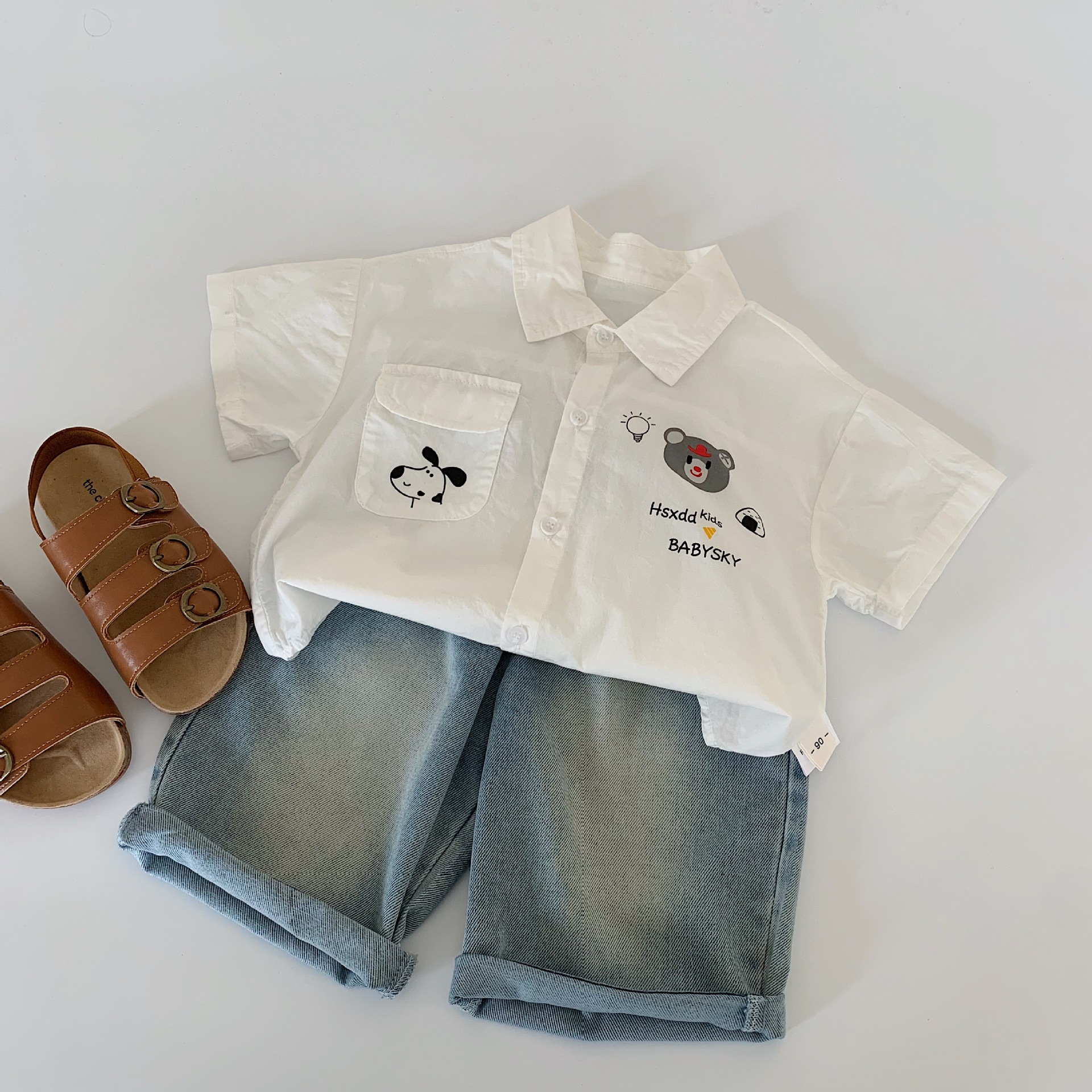 Camisa para niños Maibao 2025 verano nuevo estilo coreano niños y niñas dibujos animados camisa de manga corta ropa de verano para bebés al por mayor