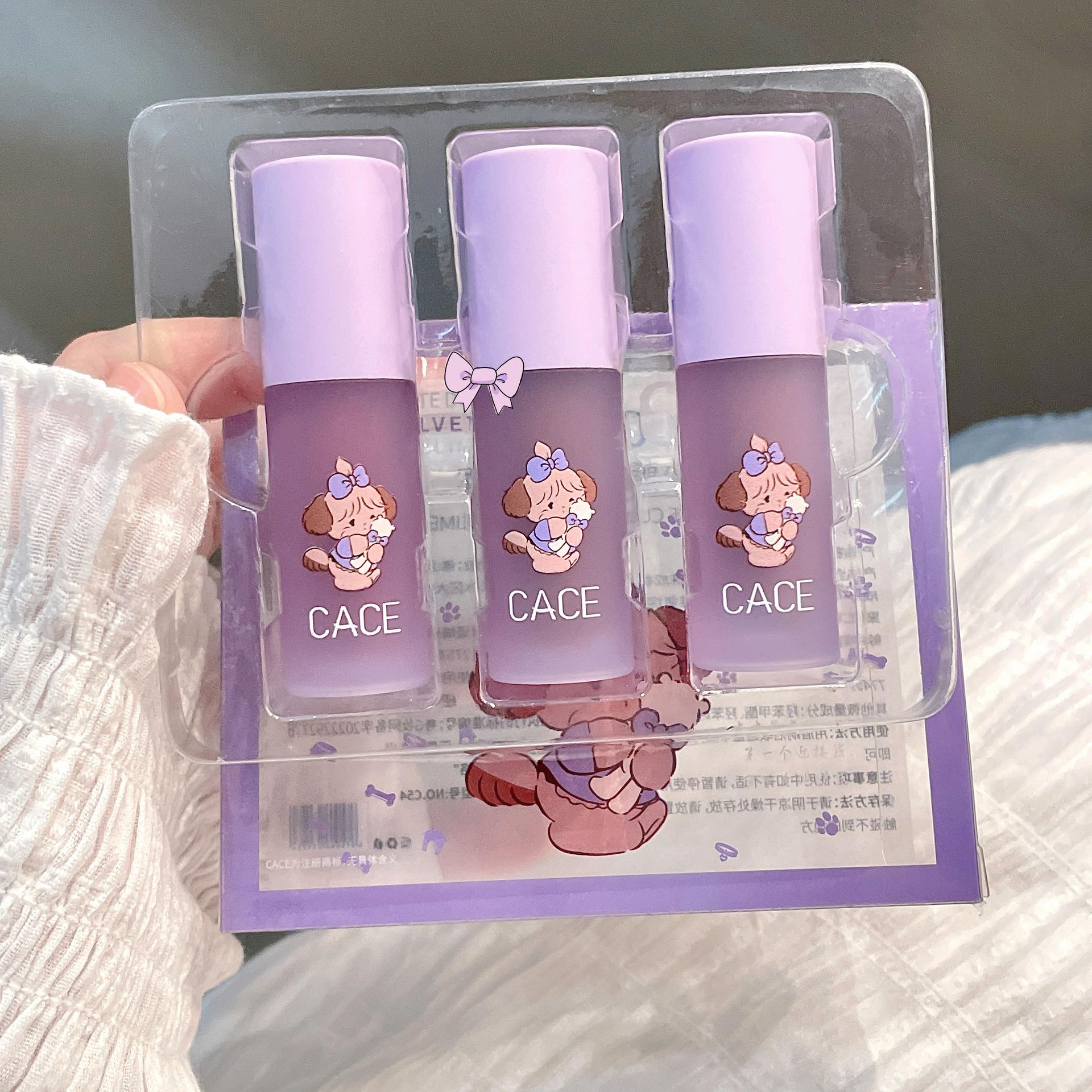 CACE Little Cute Dog Velvet Lip Gloss is available in six colors for long-lasting makeup. It is a versatile new product with a matte lip gloss that can be used for color and whitening. Wholesale undefined