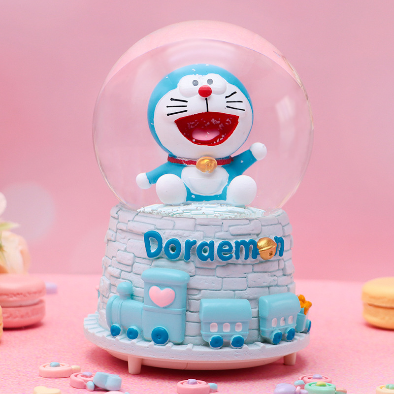 Linda campana tren azul gordo bola de cristal caja de música para niños y compañeros de clase regalo caja de música de nieve brillante