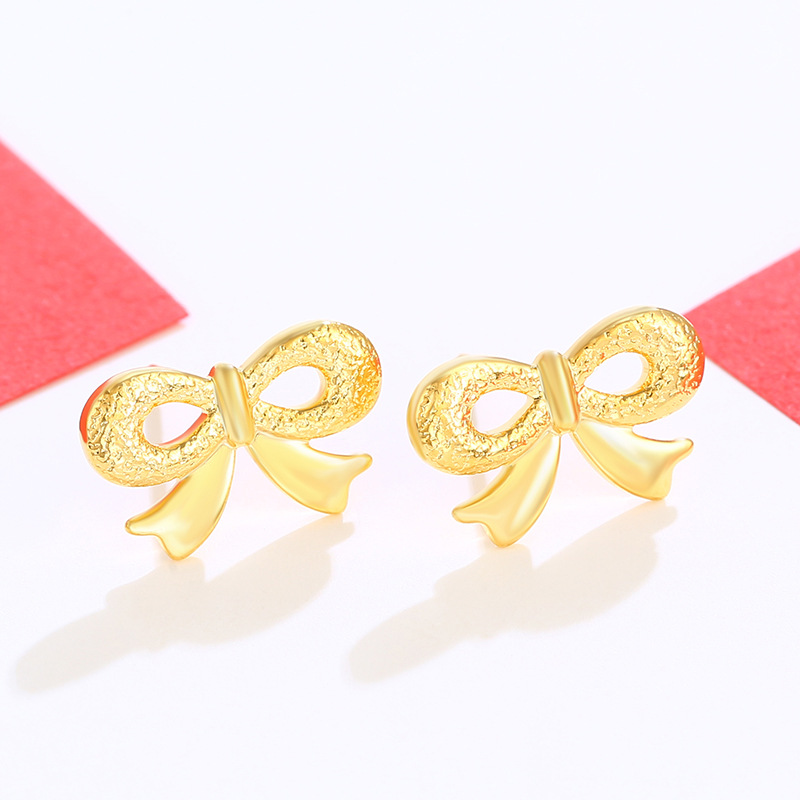 Joyería Xuping arco pernos de orejas imitación de oro encantador temperamento pequeño pendientes femeninos dulces coreanos en forma de corazón