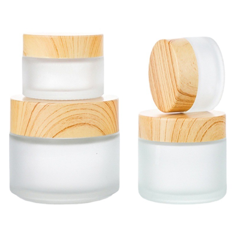 Venta al por mayor de madera grano cubierta botella de crema facial botella de crema botella cosmética de vidrio esmerilado 30g 50g crema sub-botella