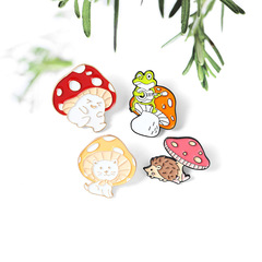 Exquisite and cute cartoon mushroom brooch featuring a frog, hedgehog, and kitten design. Pin badge accessory for collar, backpack, and clothing.
