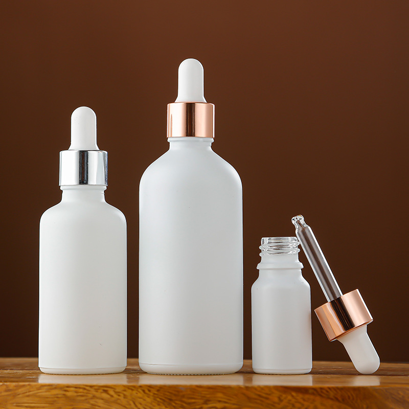 Venta al por mayor aerosol blanco botella de aceite esencial botella cosmética sub-botella 30ml esencia líquida botella redonda botella de plástico cabeza cuentagotas