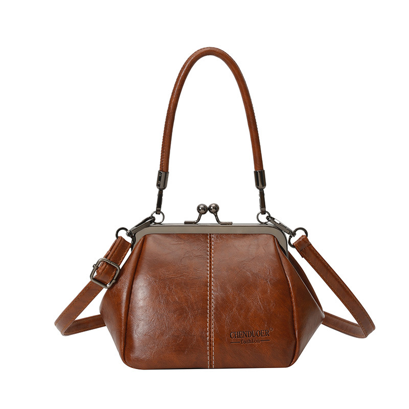 Bolso de conchas de moda para mujeres 2026 comercio exterior nuevo bolso coreano de abrazadera alta sensación retro versátil mochila