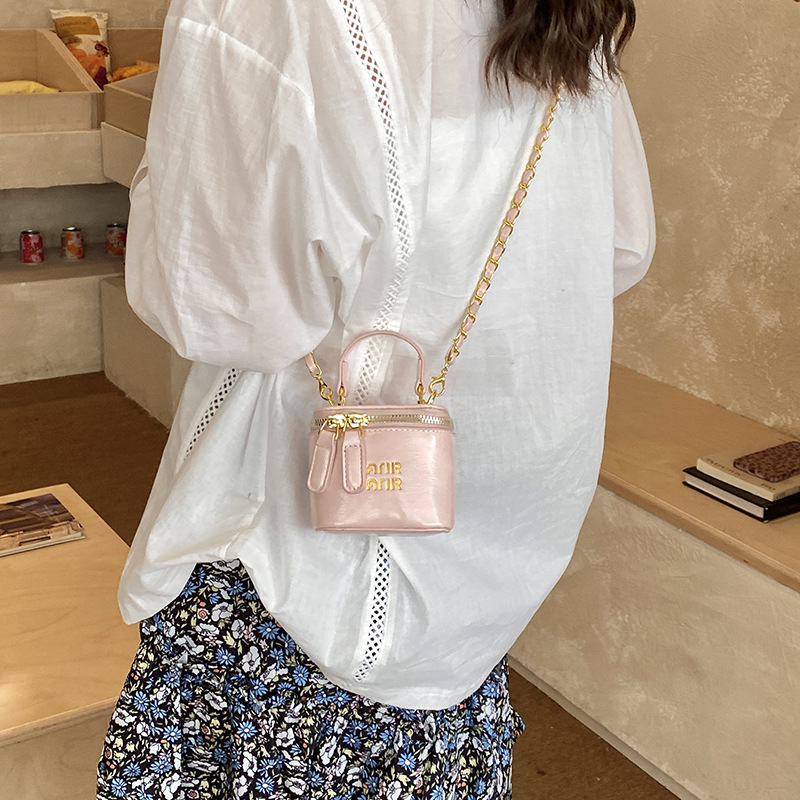 Nuevos bolsos infantiles transfronterizos letras extranjeras mini bolsos de bebé cadena de piel de aceite bolsos de caja de color sólido para niñas
