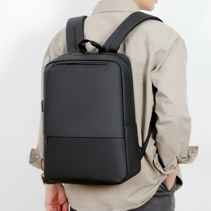 Mochila de negocios de gran capacidad para hombres nueva bolsa de computadora de oficina de color sólido simple interfaz USB mochila de negocios