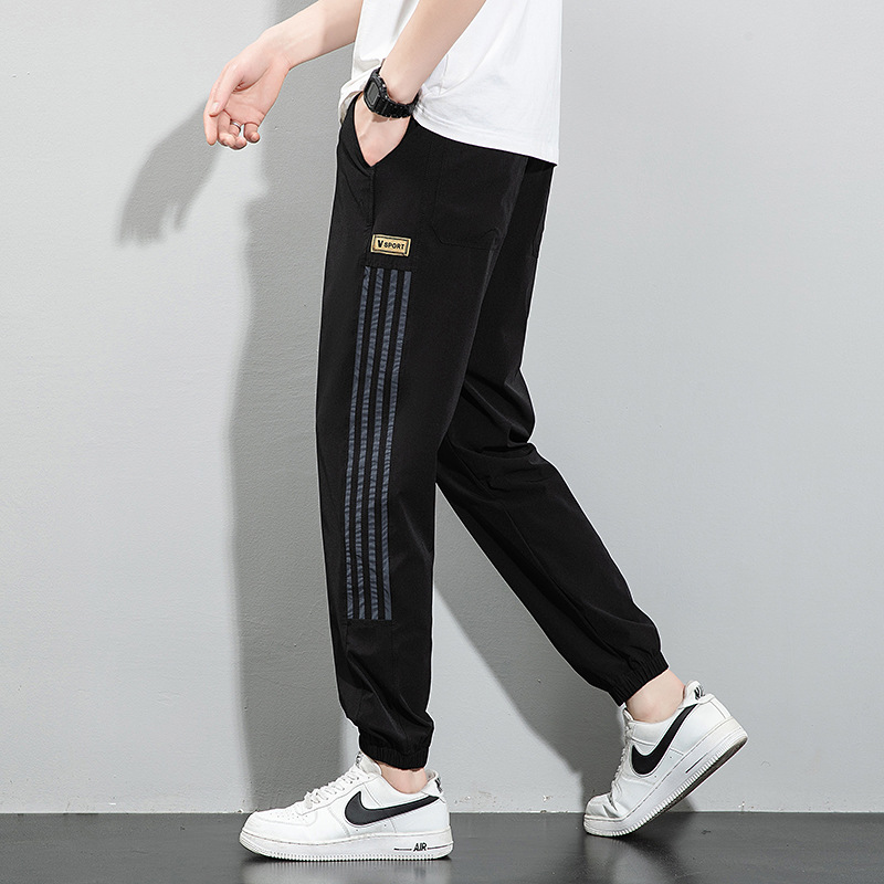 Pantalones de seda de hielo, pantalones deportivos de secado rápido de verano para hombres, pantalones casuales de nueve puntos sueltos y delgados de la marca de moda, pantalones casuales de nueve puntos al por mayor