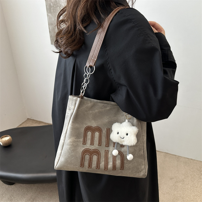 Bolsa de viaje de ocio para mujeres 2024 nueva bolsa de compras de hombro de textura simple de otoño y invierno