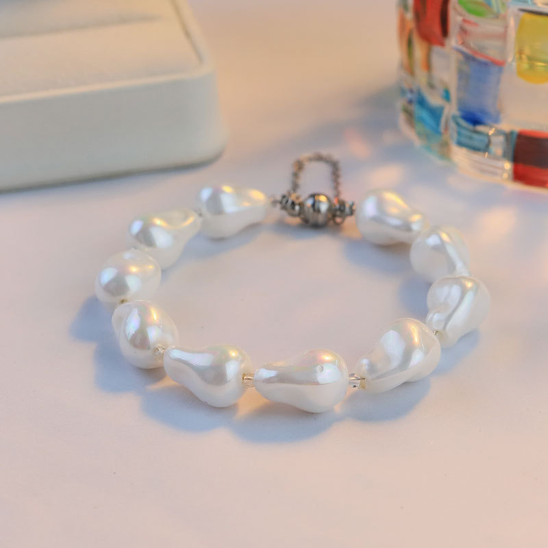 Nuevos productos de alto nivel imitación barroco pulsera de perlas nicho diseño ligero lujoso flujo de cuentas pulsera de pulsera de absorción magnética exquisita