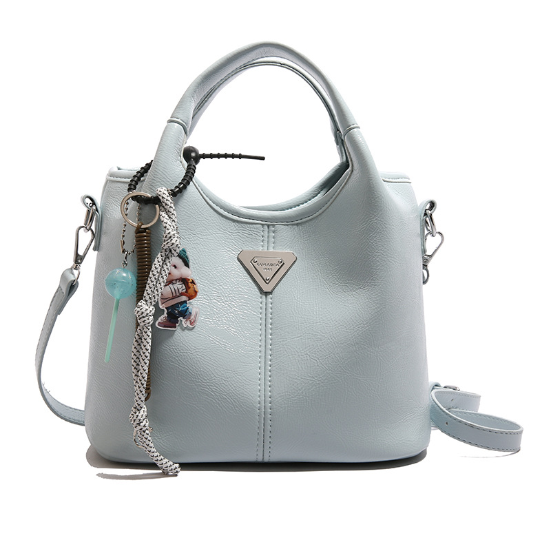 Bolsa de cubo de mano explosiva de comercio exterior para mujeres 2025 nueva moda bolsa de hombro ocio para viajar al trabajo de alta calidad bolsa madre