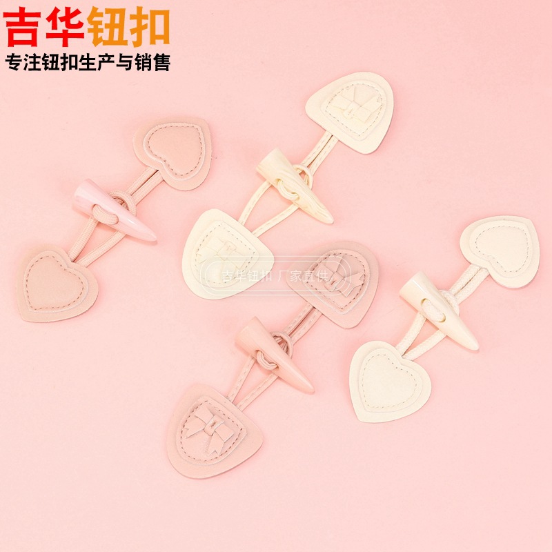 新款粉色可爱心形皮对扣女士时尚毛衣外套针织衫蝴蝶结装饰皮对扣