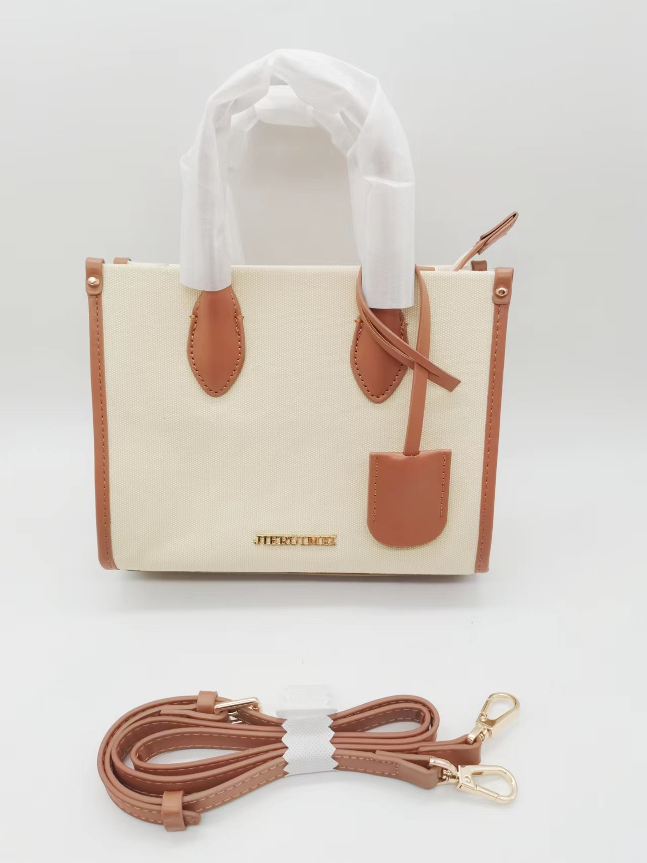 Canvas leather stitching ladies ticks across her own brand bag…