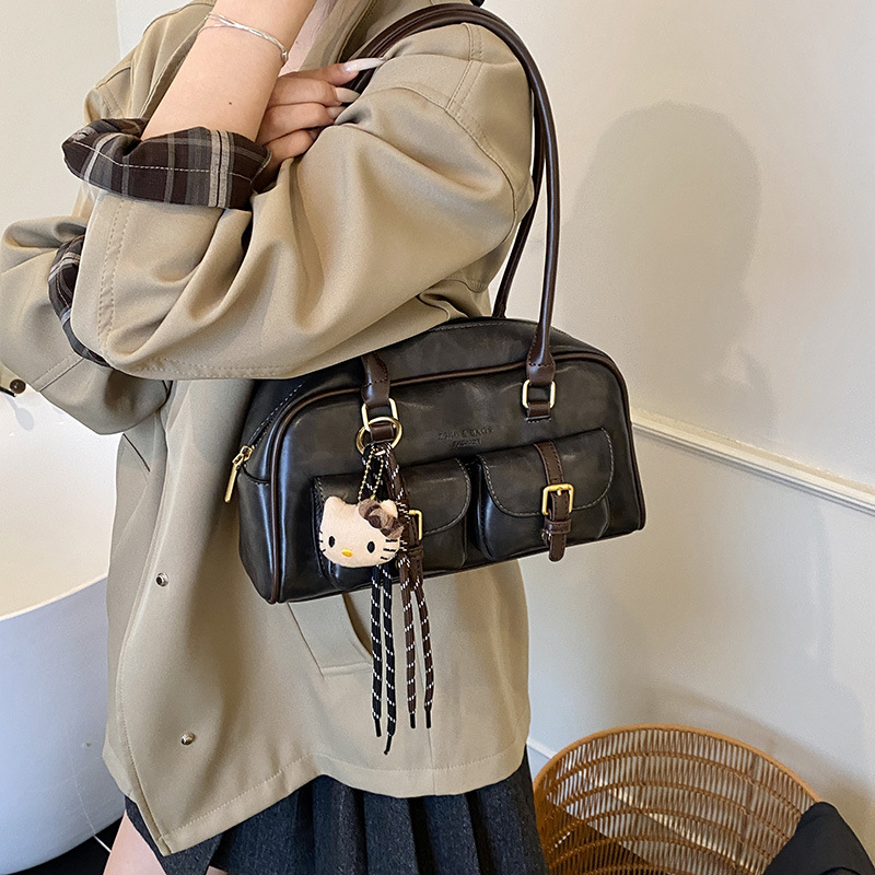 Bolsa de almohada portátil simple coreana transfronteriza para mujeres otoño / invierno 2025 nuevo retro versátil bolso de hombro bolso de brazo de viaje