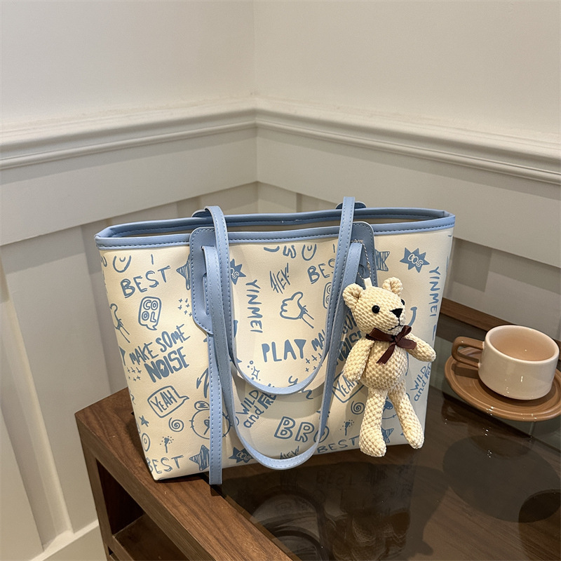 Cute casual oso estampado de gran capacidad 2024 nuevo estilo simple viajero de un solo hombro bolso portátil para estudiante bolso femenino