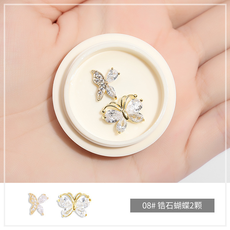 Online popular hielo transparente Aurora mariposa joyería cristal blanco piedra tridimensional uñas diamante Super Flash rhinestone uñas joyería