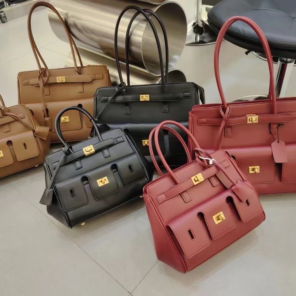 2024 nuevo bolso Tote con cerradura Roden de gran capacidad bolso de ala de motocicleta neutral bolso de hombro de cuero Tote bolso