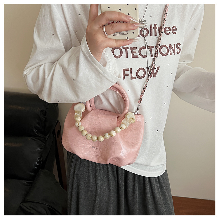 A stylish and trendy beaded bag for women, a new summer chain crossbody cloud bag for women in 2025 undefined
