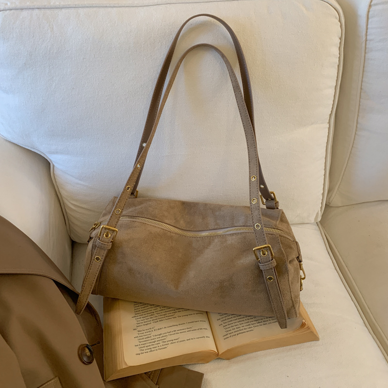 Otoño e invierno lazo bolsa de viento para mujeres 2025 nuevo retro cuero blando hombro brazo bolso de almohada de viaje bolso de mano