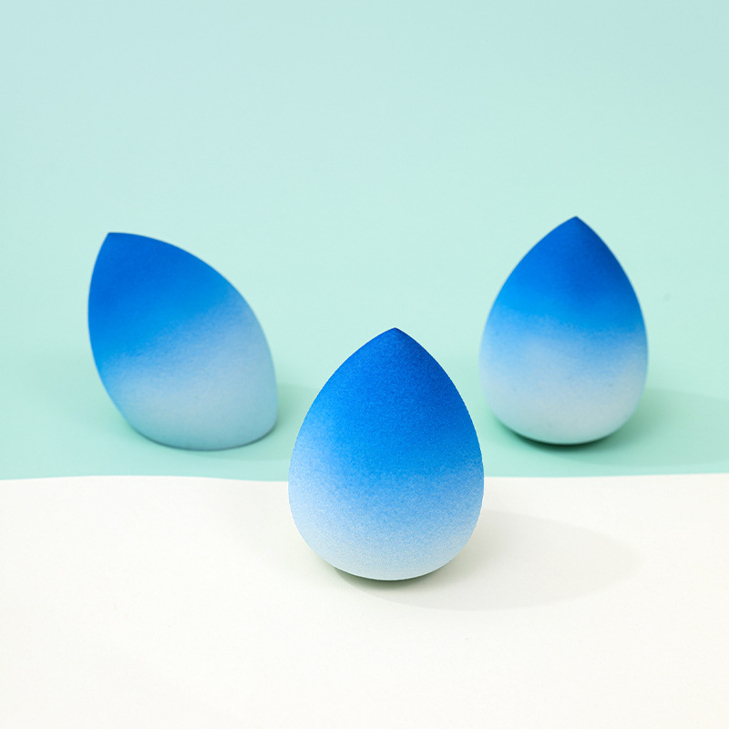 Huevo de maquillaje de belleza de color degradado personalizado de fábrica, no coma polvo, no látex, color en aerosol, maquillaje en forma de calabaza, esponja, huevo de maquillaje