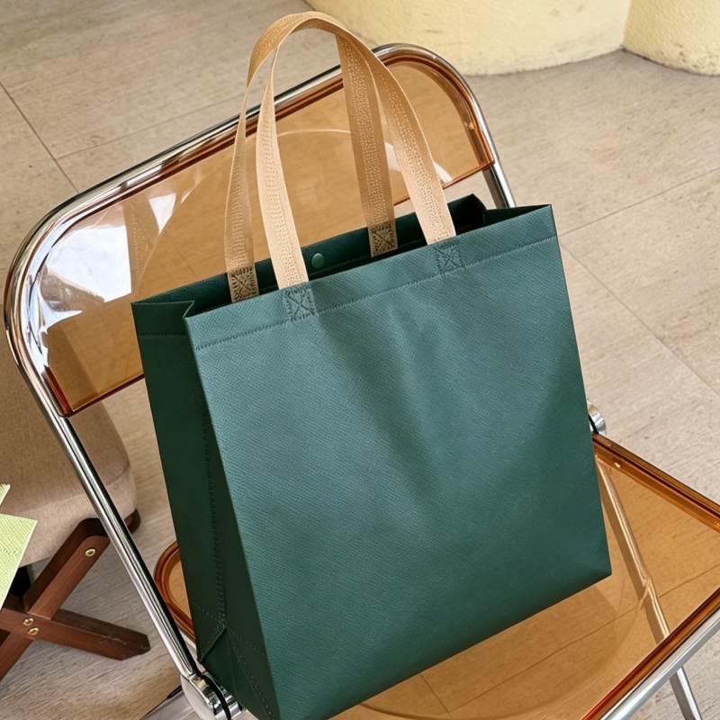 Bolsas de mano no tejidas en blanco personalizadas bolsas de ropa de pequeño volumen bolsas de compras de ropa bolsas de tela no tejida ecológica personalizadas