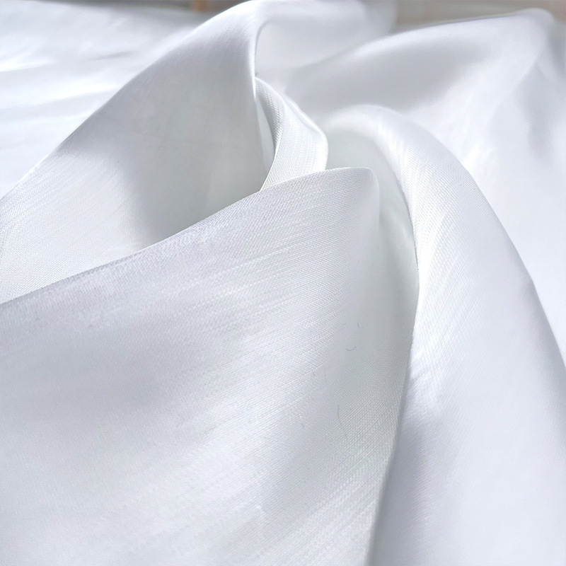 布艺白色水光琉璃丝麻纱高亮光泽闪光高端汉服礼服连衣裙布料面料