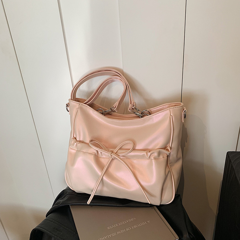 Fashionable capacious one-shoulder bag with bow