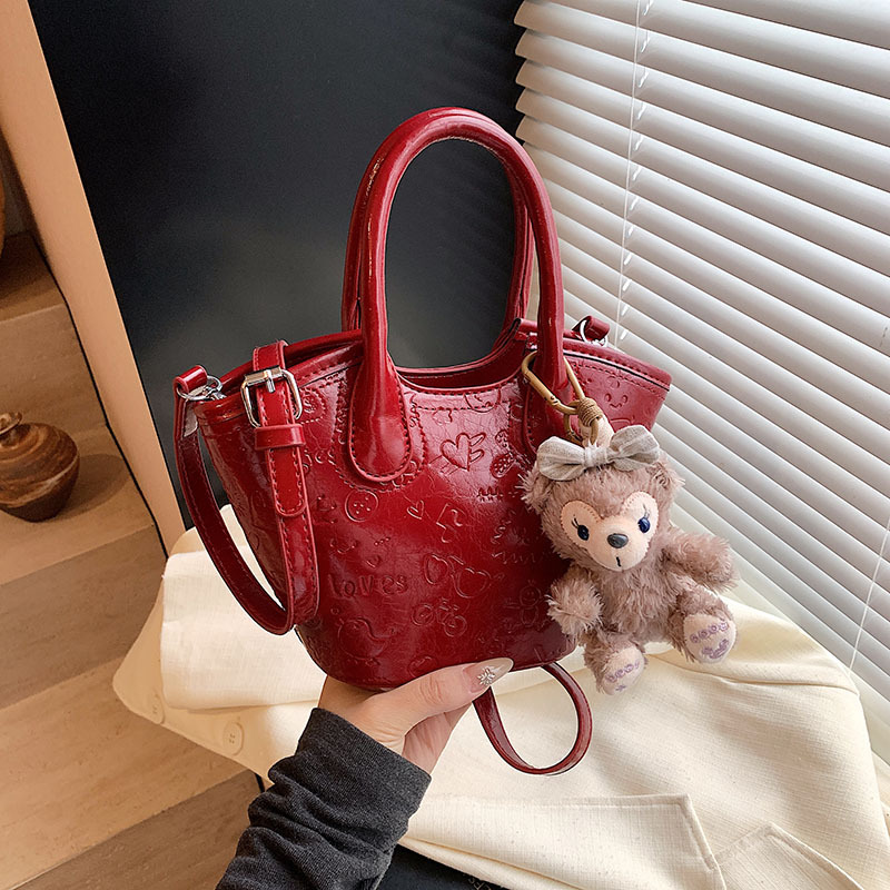 Nicho coreano bolsas de cesta de verduras de mano primavera de mujeres 2025 nueva moda encantadora bolsa en relieve bolsas de mochila