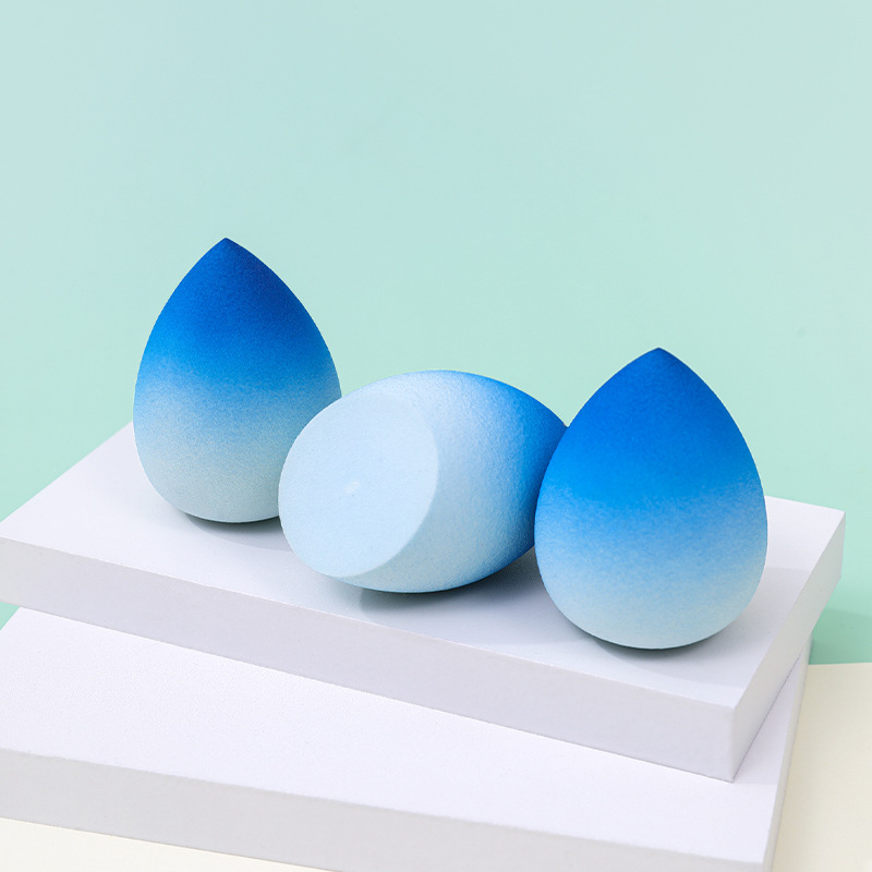 Huevo de maquillaje de belleza de color degradado personalizado de fábrica, no coma polvo, no látex, color en aerosol, maquillaje en forma de calabaza, esponja, huevo de maquillaje