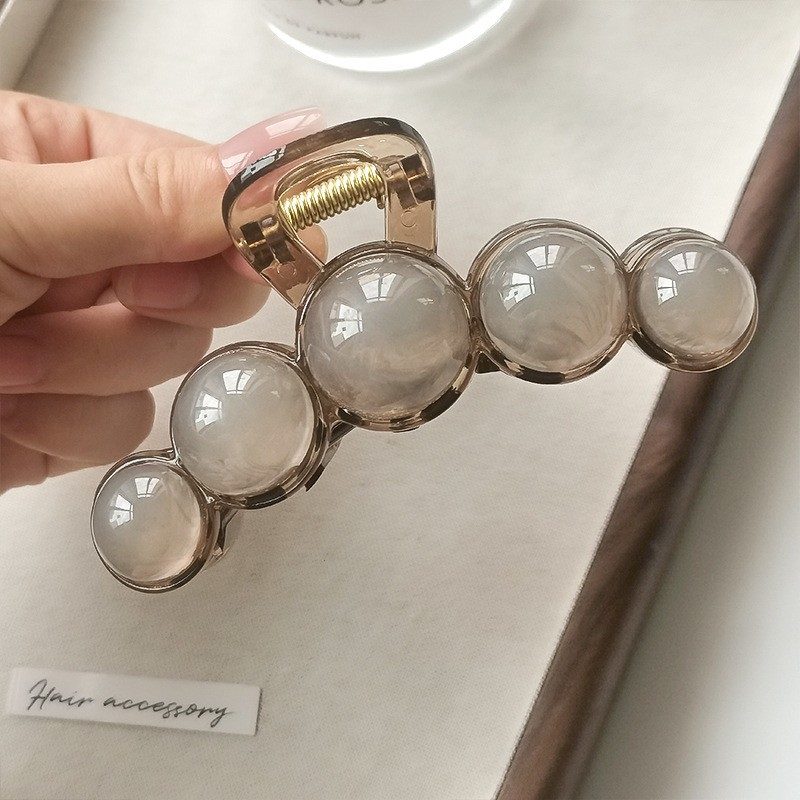 Elegant round beads, small crab pin