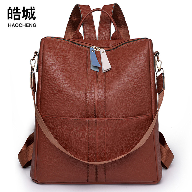 Spot al por mayor 2023 nueva mochila de cuero suave para mujer casual simple y versátil mochila de viaje de gran capacidad