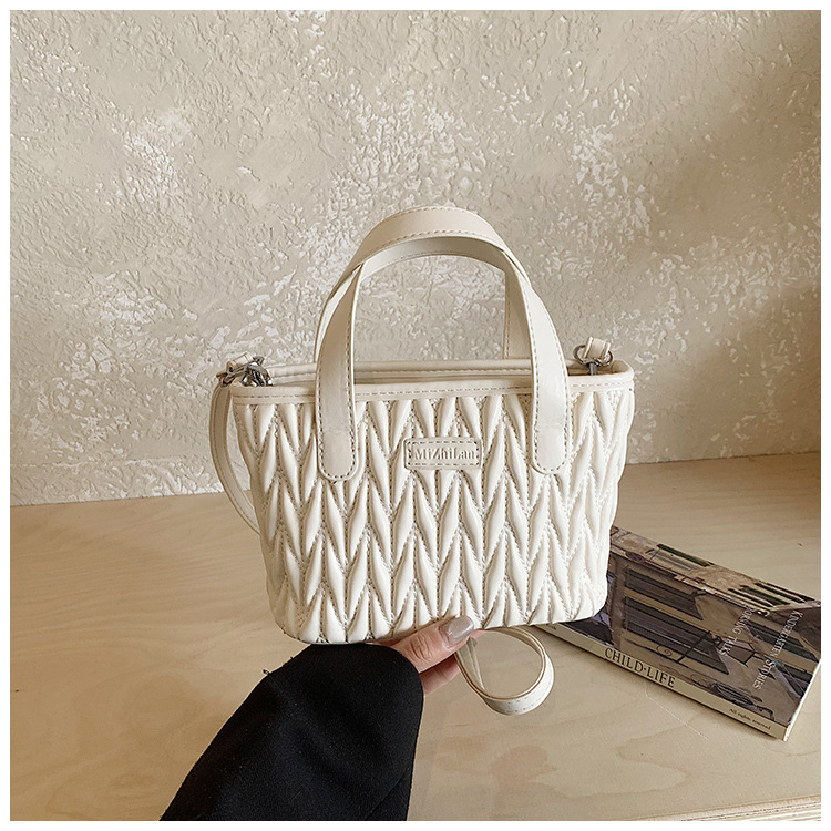 Coreano simple bolso de mano plegable de color sólido bordado de estilo extranjero bolso de hombro para hombres y mujeres nuevos accesorios para niños transfronterizos