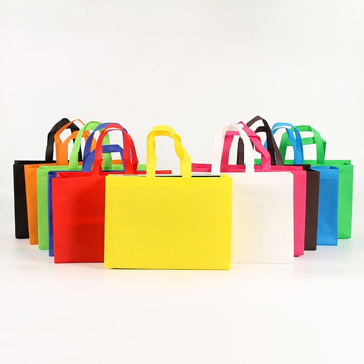 Bolsas de tela no tejida de gran tamaño recubiertas de película de mujer en stock bolsas de compras prensadas en caliente fijas pueden imprimir bolsas de publicidad LOGO