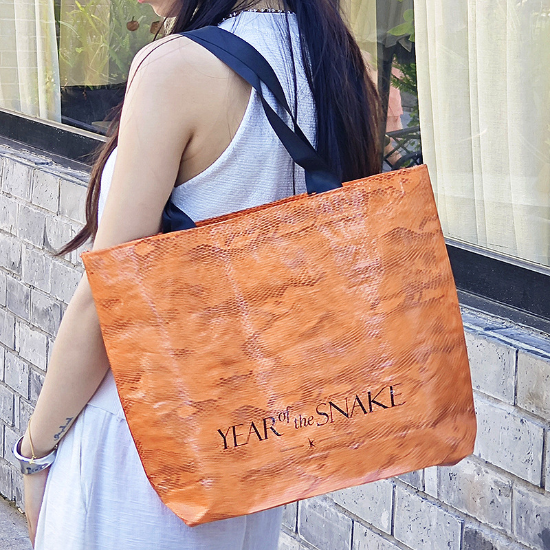 PP编织袋防水防尘袋子衣服装广告活动购物蛇皮手提手拎袋制定logo