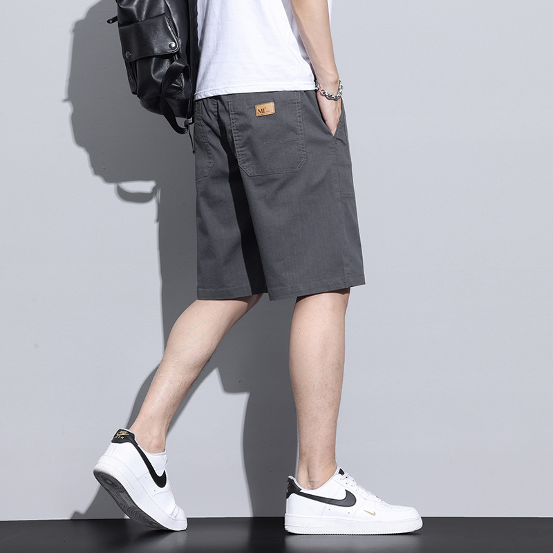 Pantalones cortos de seda de hielo para niños pantalones casuales transpirables delgados de verano 2025 nuevos pantalones de cinco puntos sueltos rectos para hombres