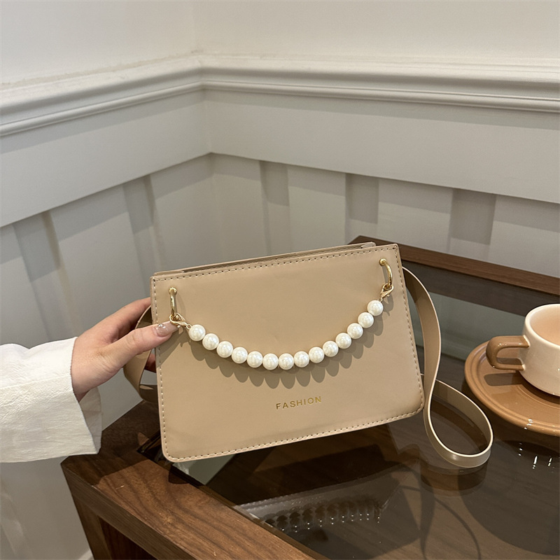 Bolso de nicho de sentido de alta gama para mujer 2024 nuevo bolso de hombro de cadena de perlas de moda salvaje bandolera bandolera