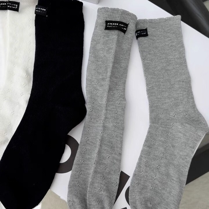 European-style simple and sweet lace socks with letter tags, similar to the Poislan design, mid-calf length, hollowed-out and breathable