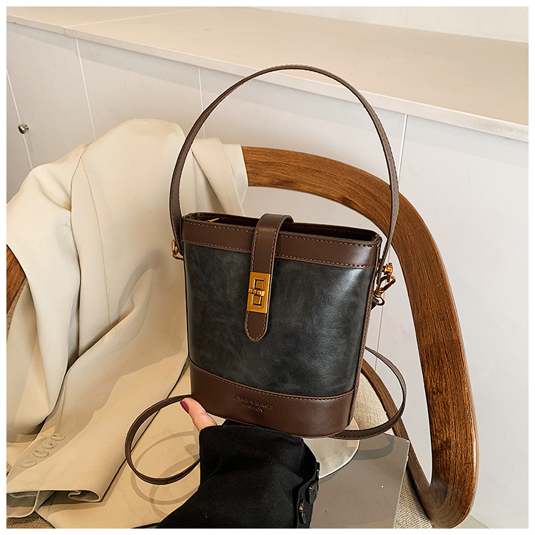 A retro color-blocking and textured hand-held bucket bag for women, a new 2024 trendy and fashionable small bag, a crossbody bag undefined