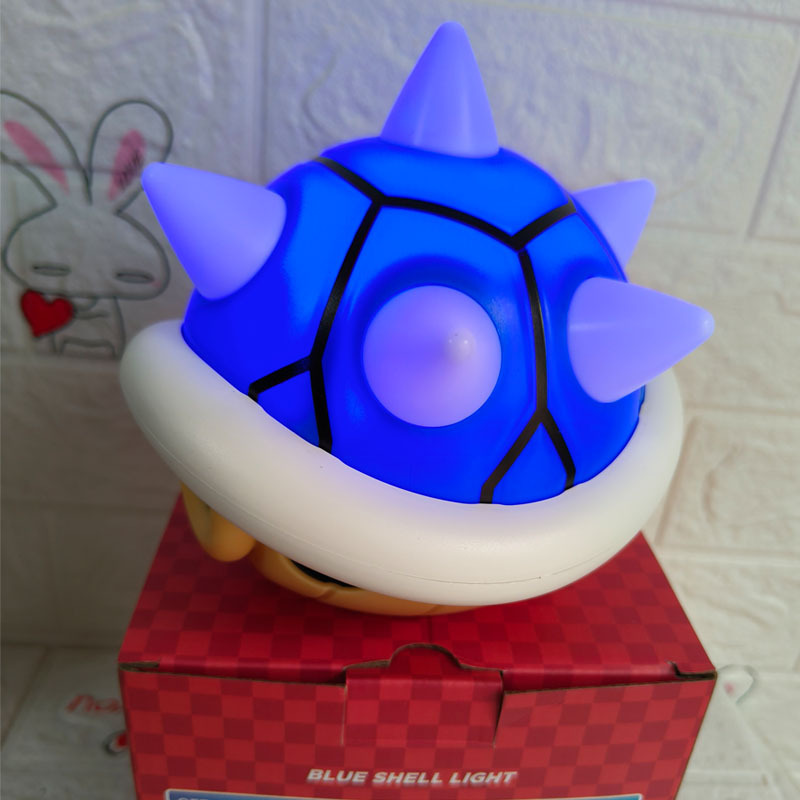 Luz con forma de signo de interrogación que mueve la lengua, luz con sonido de expresión de fantasma, luz de ambiente de juego, luz nocturna activada por voz de Toy Story.