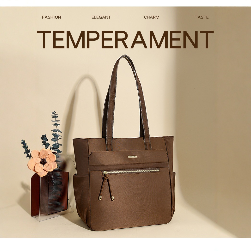 Bolso Tote casual coreano 2025 nueva moda textura de viaje salvaje bolso de mano de un solo hombro suministro directo de fábrica