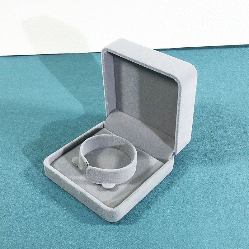 Light gray bracelet box; rounded velvet box